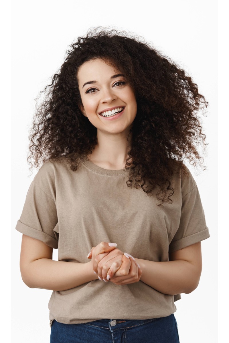 friendly-smiling-brunette-woman-ready-help-assist-holding-hands-together-looking-pleasant-standing-t-shirt-against-white-background (1) (1)